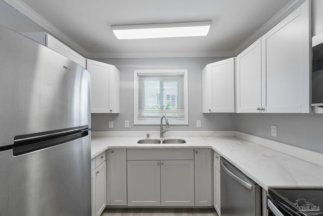 14100 River Rd Unit 223B, Pensacola, FL 32507 - kitchen with appliances with stainless steel finishes, a sink, ornamental molding, white cabinets, and light stone countertops