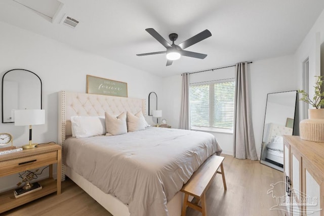 bedroom with ceiling fan and light hardwood / wood-style flooring