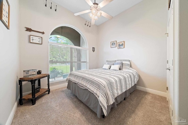 bedroom featuring ceiling fan and light carpet