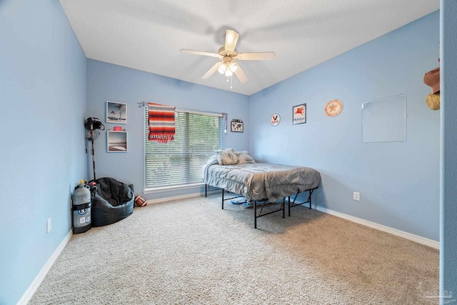 bedroom with ceiling fan and carpet