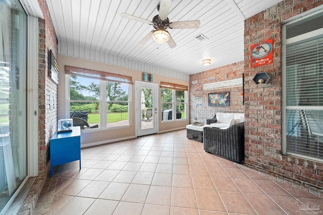 sunroom / solarium with wood ceiling and ceiling fan