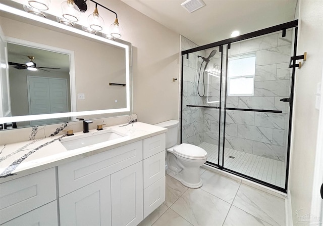 bathroom with walk in shower, vanity, toilet, and ceiling fan