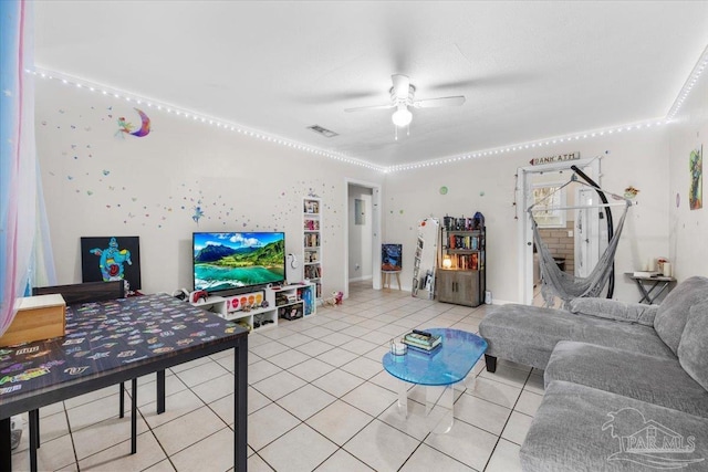 tiled living room with ceiling fan