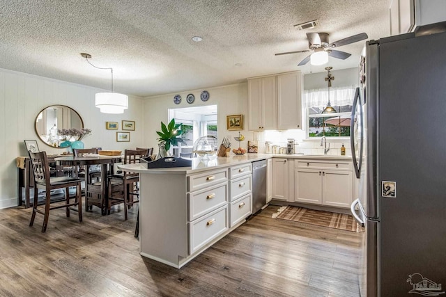 2519 Inda Ave, Pensacola, FL 32526 - kitchen with a peninsula, a wealth of natural light, appliances with stainless steel finishes, and a sink