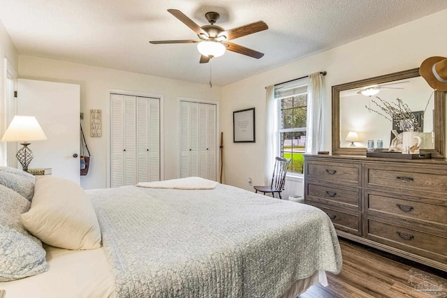 2519 Inda Ave, Pensacola, FL 32526 - bedroom featuring two closets, dark wood-style floors, a ceiling fan, and a textured ceiling