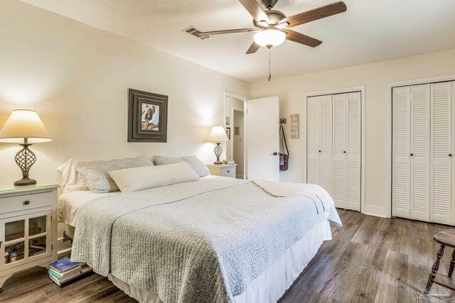 bathroom featuring vanity, hardwood / wood-style flooring, toilet, and a shower with shower door