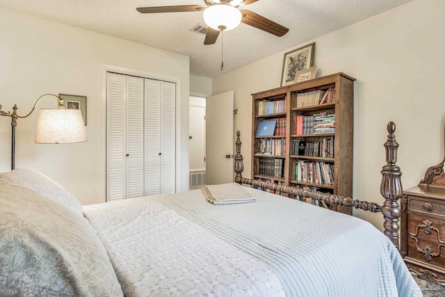 bedroom with a textured ceiling, a closet, and ceiling fan