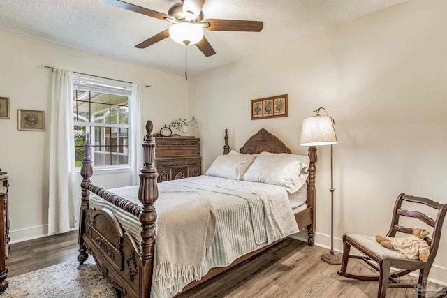 2519 Inda Ave, Pensacola, FL 32526 - bedroom with a textured ceiling, a ceiling fan, baseboards, and wood finished floors