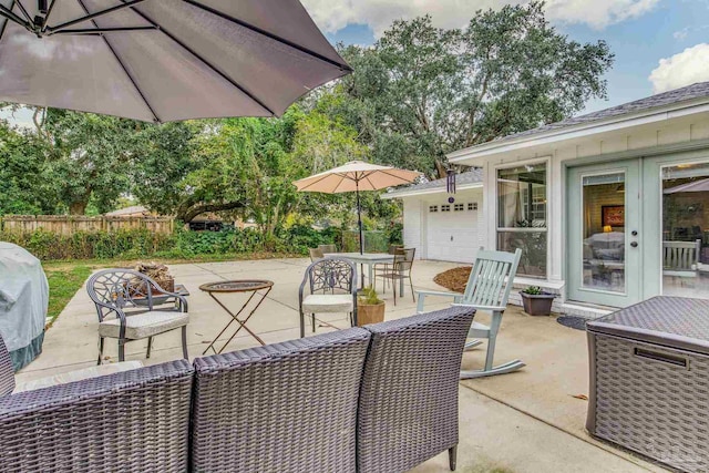 view of patio with a garage and grilling area