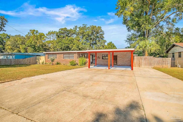 ranch-style home with a front lawn