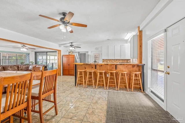 dining area featuring a textured ceiling