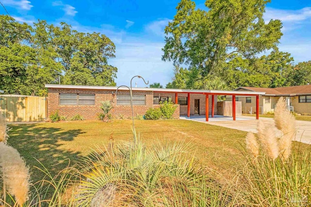 view of front facade featuring a front lawn and a patio area