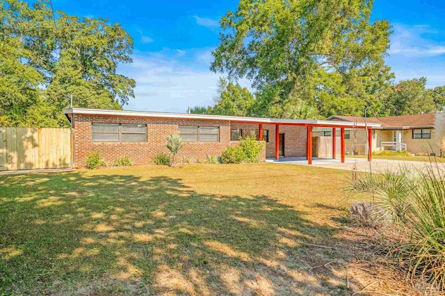 single story home with a front lawn and a patio