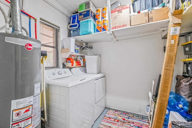 laundry room featuring water heater and independent washer and dryer