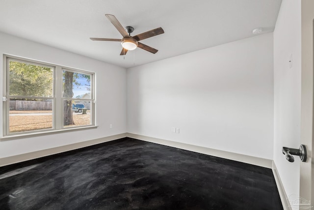 spare room with ceiling fan