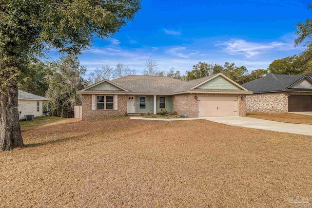 single story home featuring central AC, a garage, and a front lawn