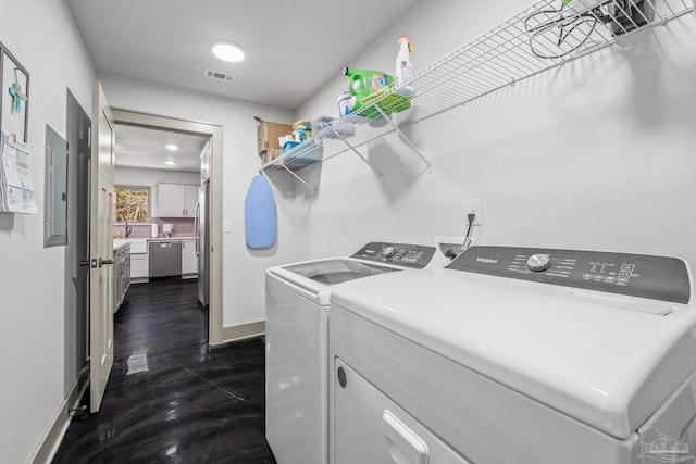 laundry area with independent washer and dryer