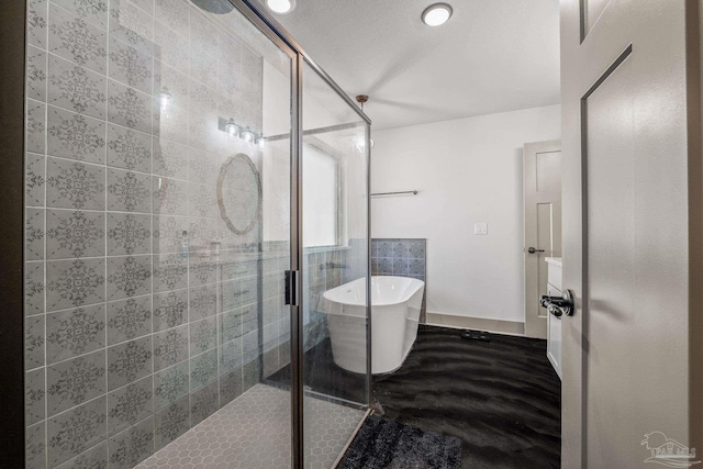 bathroom with separate shower and tub and a textured ceiling