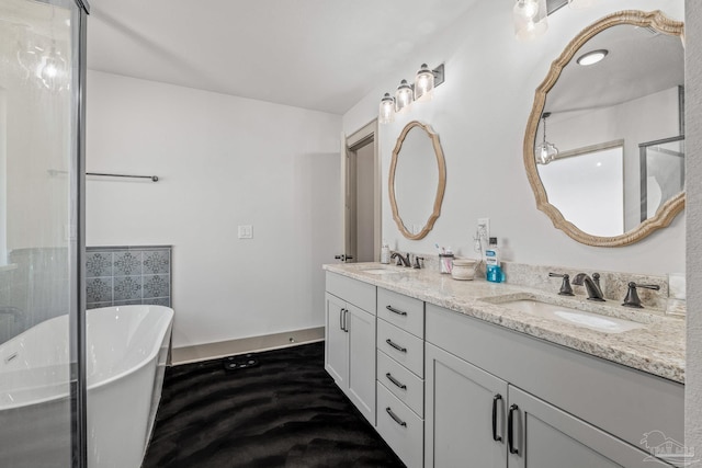 bathroom with vanity and a bath