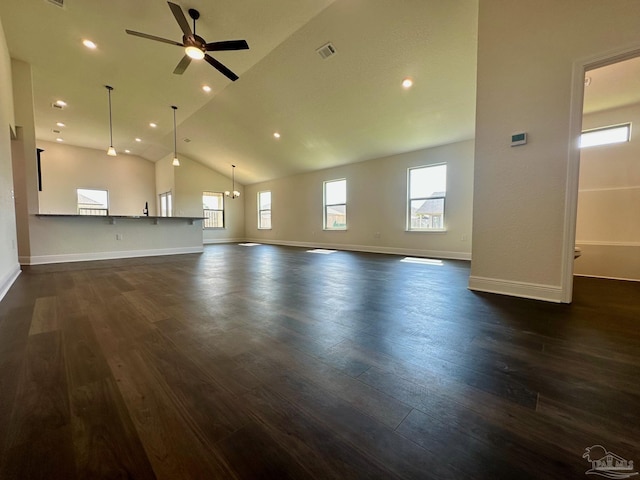unfurnished living room featuring a ceiling fan, dark wood-style floors, and lofted ceiling