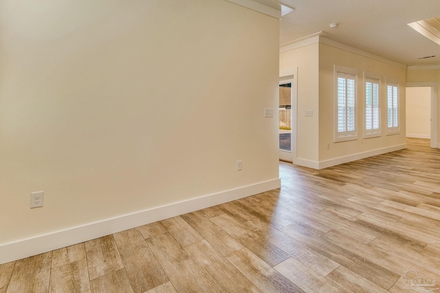 unfurnished room with light hardwood / wood-style floors and ornamental molding