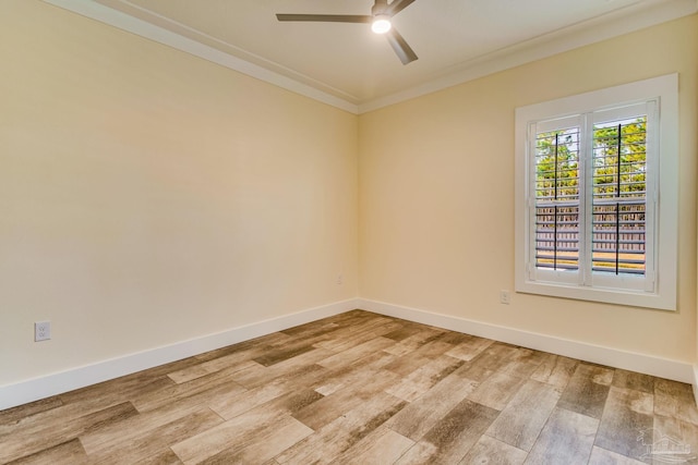 spare room featuring ceiling fan, ornamental molding, and light hardwood / wood-style flooring