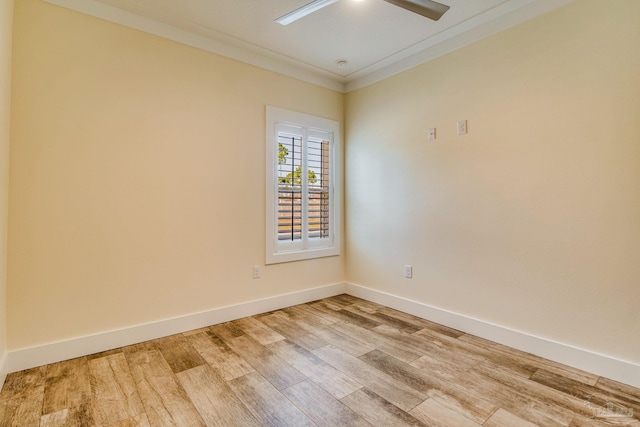 spare room with hardwood / wood-style flooring, ceiling fan, and crown molding