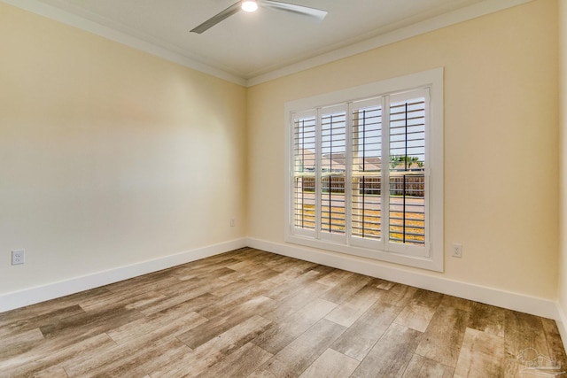 spare room with crown molding, ceiling fan, and light wood-type flooring