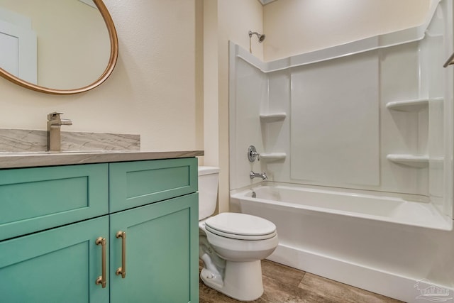 full bathroom featuring vanity,  shower combination, and toilet