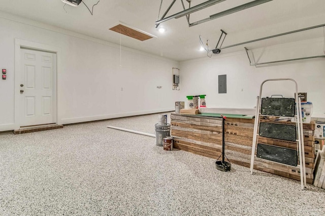 garage featuring electric panel and a garage door opener