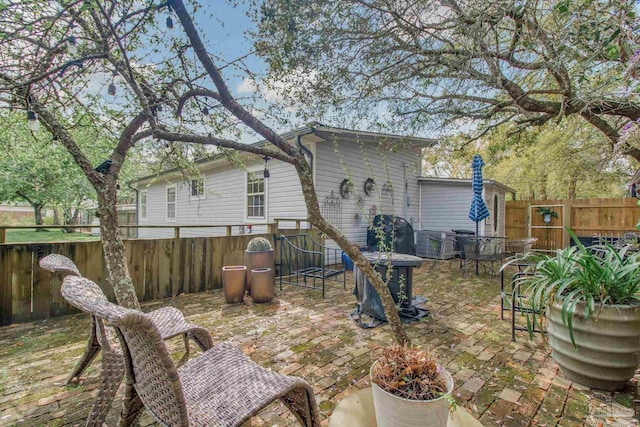 back of house with a patio area