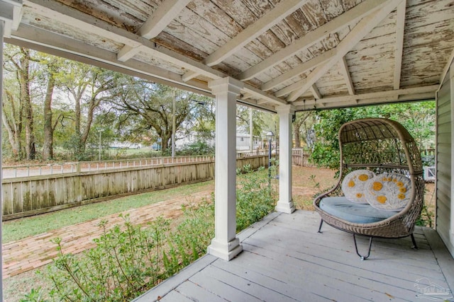 wooden terrace featuring a gazebo