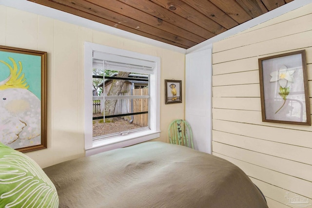 bedroom featuring lofted ceiling and wood ceiling