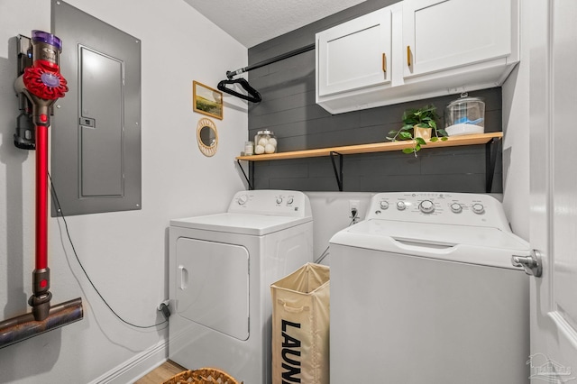 8820 Smiley Ct, Pensacola, FL 32514 - washroom featuring cabinet space, electric panel, and separate washer and dryer