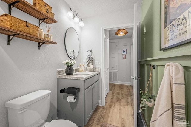 8820 Smiley Ct, Pensacola, FL 32514 - half bathroom with vanity and wood finished floors