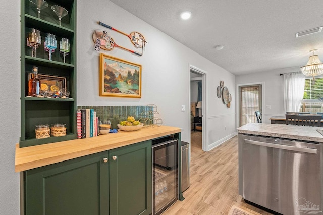 8820 Smiley Ct, Pensacola, FL 32514 - kitchen featuring green cabinetry, dishwasher, beverage cooler, wood counters, and a textured ceiling