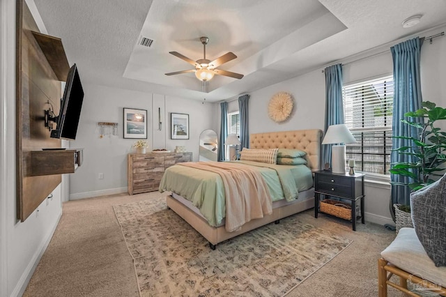 8820 Smiley Ct, Pensacola, FL 32514 - carpeted bedroom featuring a raised ceiling, a textured ceiling, and ceiling fan