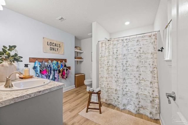 8820 Smiley Ct, Pensacola, FL 32514 - full bath with vanity, wood finished floors, and a shower with shower curtain
