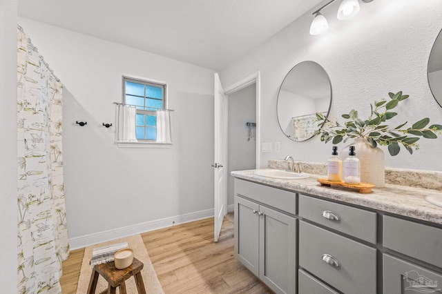 8820 Smiley Ct, Pensacola, FL 32514 - bathroom with double vanity and wood finished floors
