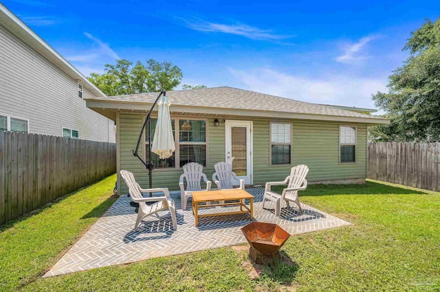 8820 Smiley Ct, Pensacola, FL 32514 - rear view of property featuring a patio, a fenced backyard, and roof with shingles