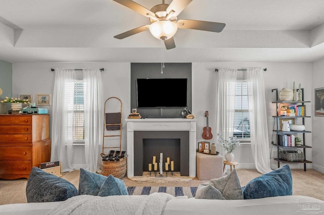8820 Smiley Ct, Pensacola, FL 32514 - carpeted living room with a ceiling fan and a fireplace with flush hearth