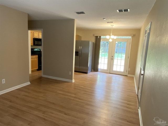 925 Artesian Ave, Pensacola, FL 32505 - unfurnished dining area featuring visible vents, light wood finished floors, and a notable chandelier