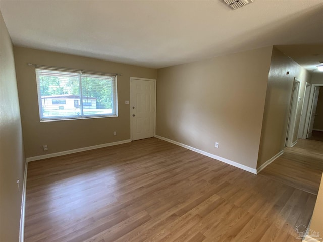 925 Artesian Ave, Pensacola, FL 32505 - unfurnished room with baseboards, light wood-style flooring, and visible vents