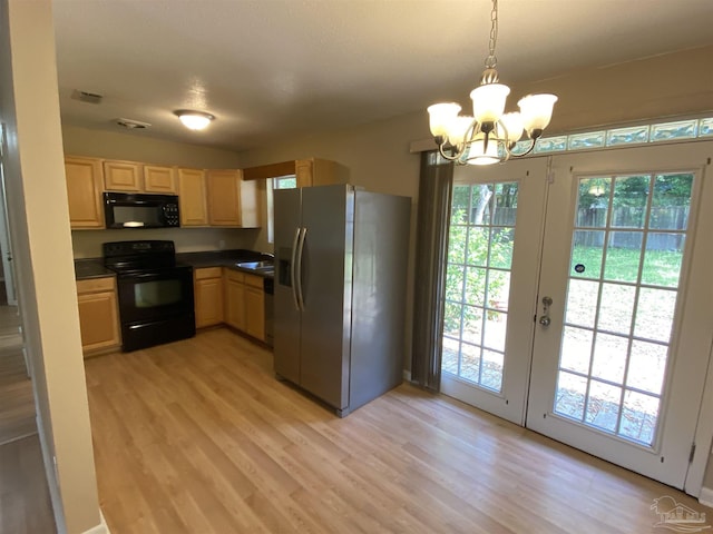 925 Artesian Ave, Pensacola, FL 32505 - kitchen with a sink, plenty of natural light, black appliances, and light wood-style flooring