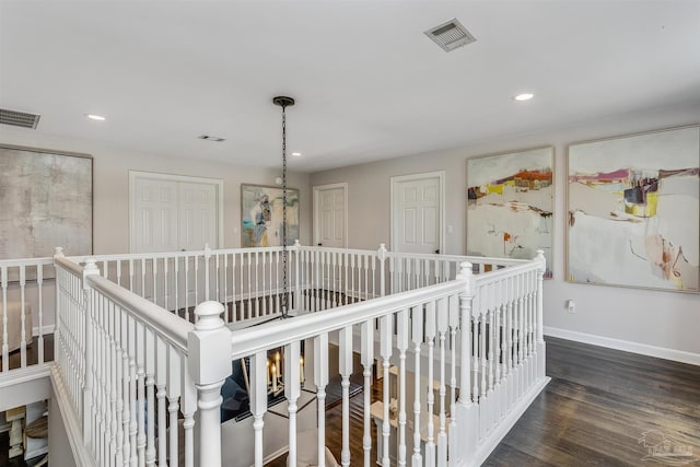 hallway featuring dark hardwood / wood-style flooring