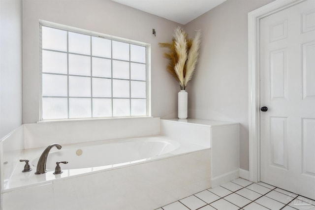 bathroom featuring tile patterned floors and a tub