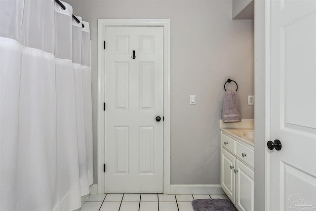 bathroom with tile patterned flooring and vanity