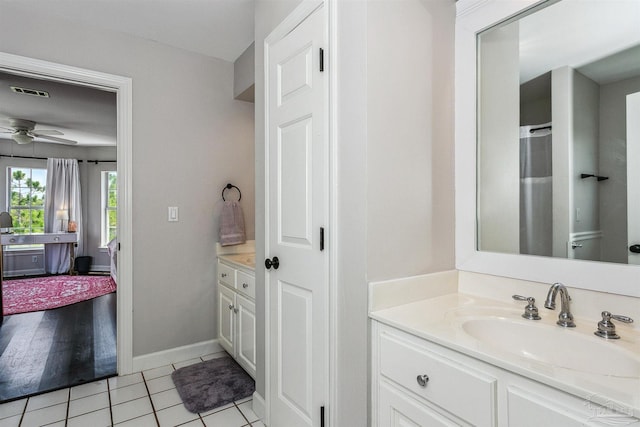 bathroom with tile patterned floors, ceiling fan, and vanity