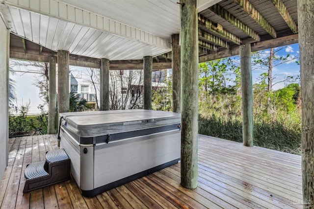 wooden terrace featuring a hot tub