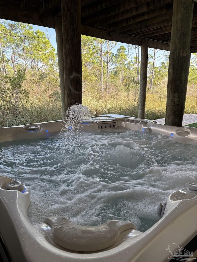 exterior details featuring a jacuzzi